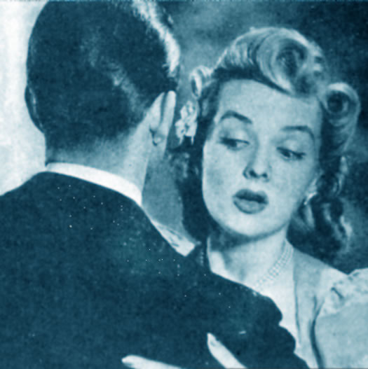 woman looking at man's collar